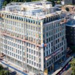 Beginning of a high-rise building with scaffolds and metal reinforcements in place