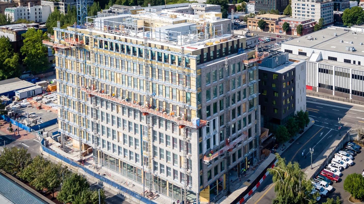 Beginning of a high-rise building with scaffolds and metal reinforcements in place